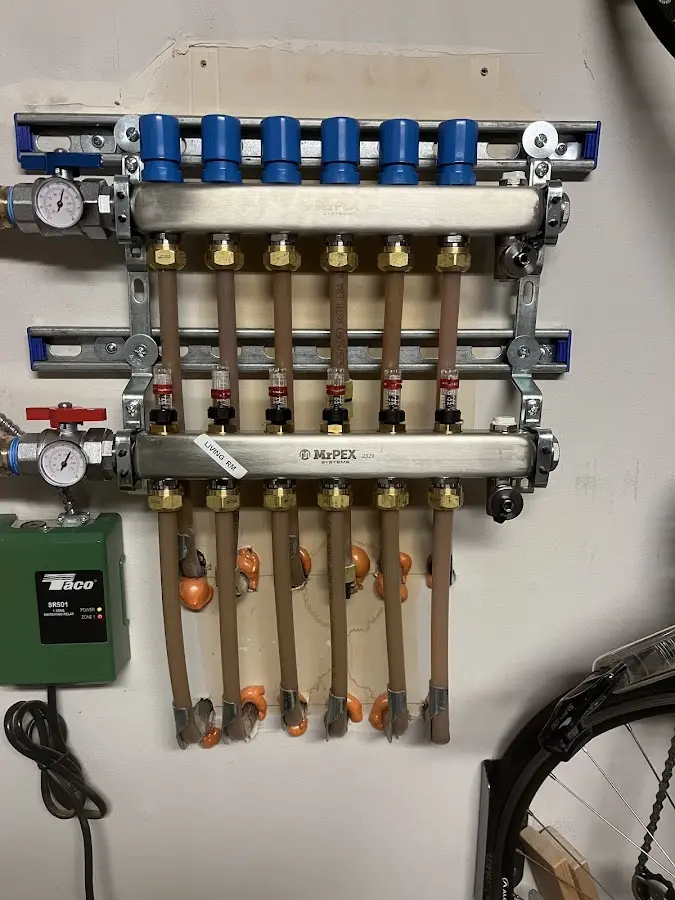 Plumber performing Water Heater Repair at a residential property in Newtown